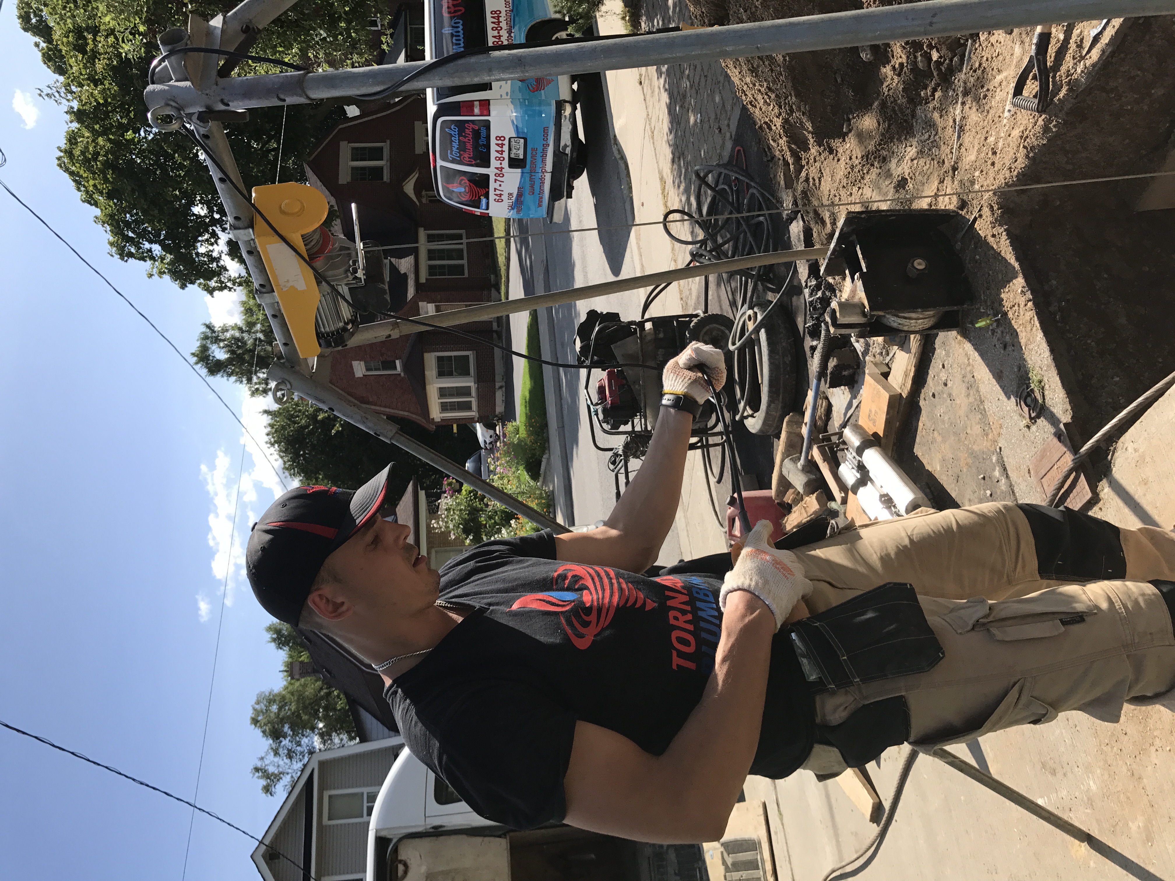 Serhiy Marunchuk working on an outdoor Tornado Plumbing & Drains job site